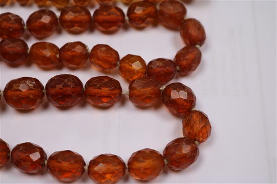 Five assorted amber necklaces.